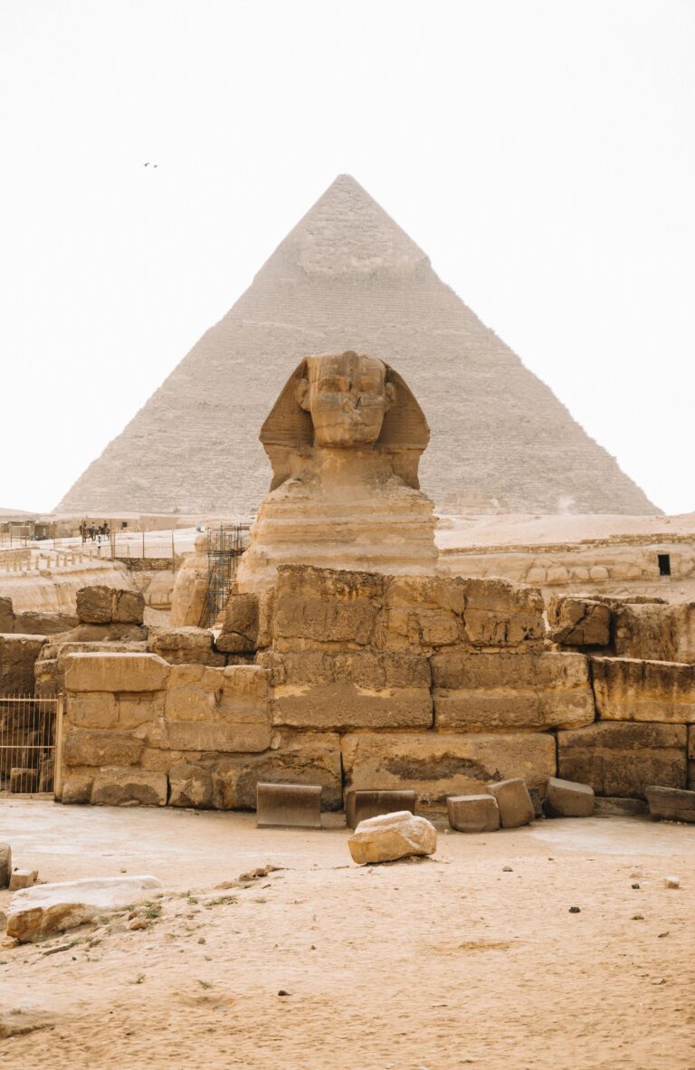 Iconic view of the Sphinx with the Pyramid of Khafre in Giza, Egypt.