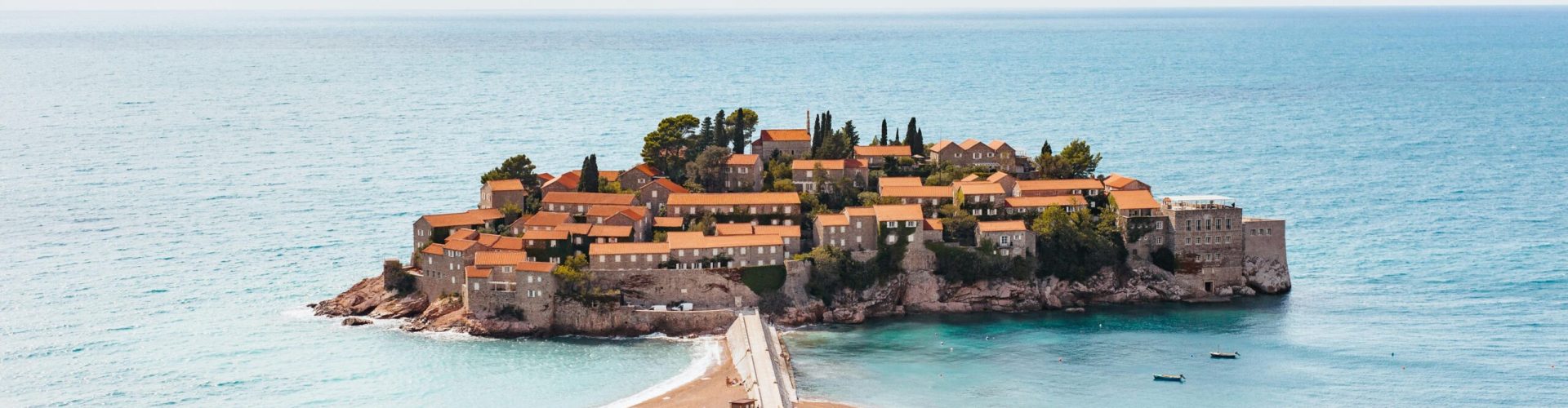 Explore the stunning picturesque village of Sveti Stefan, a top travel destination in Montenegro.