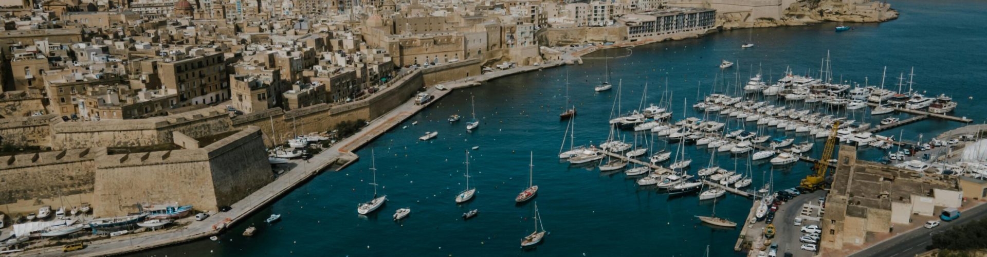 Stunning aerial view of Kalkara, Malta showcasing the harbor with boats and historic architecture.